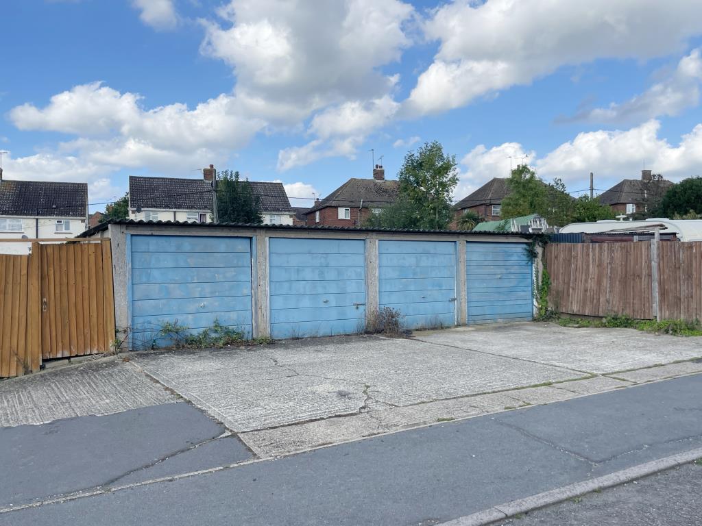 Lot: 40 - NINE GARAGES AND LAND - Four garages in village